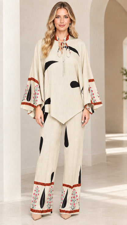 Front view of women's beige cream printed tunic and wide-leg pants set