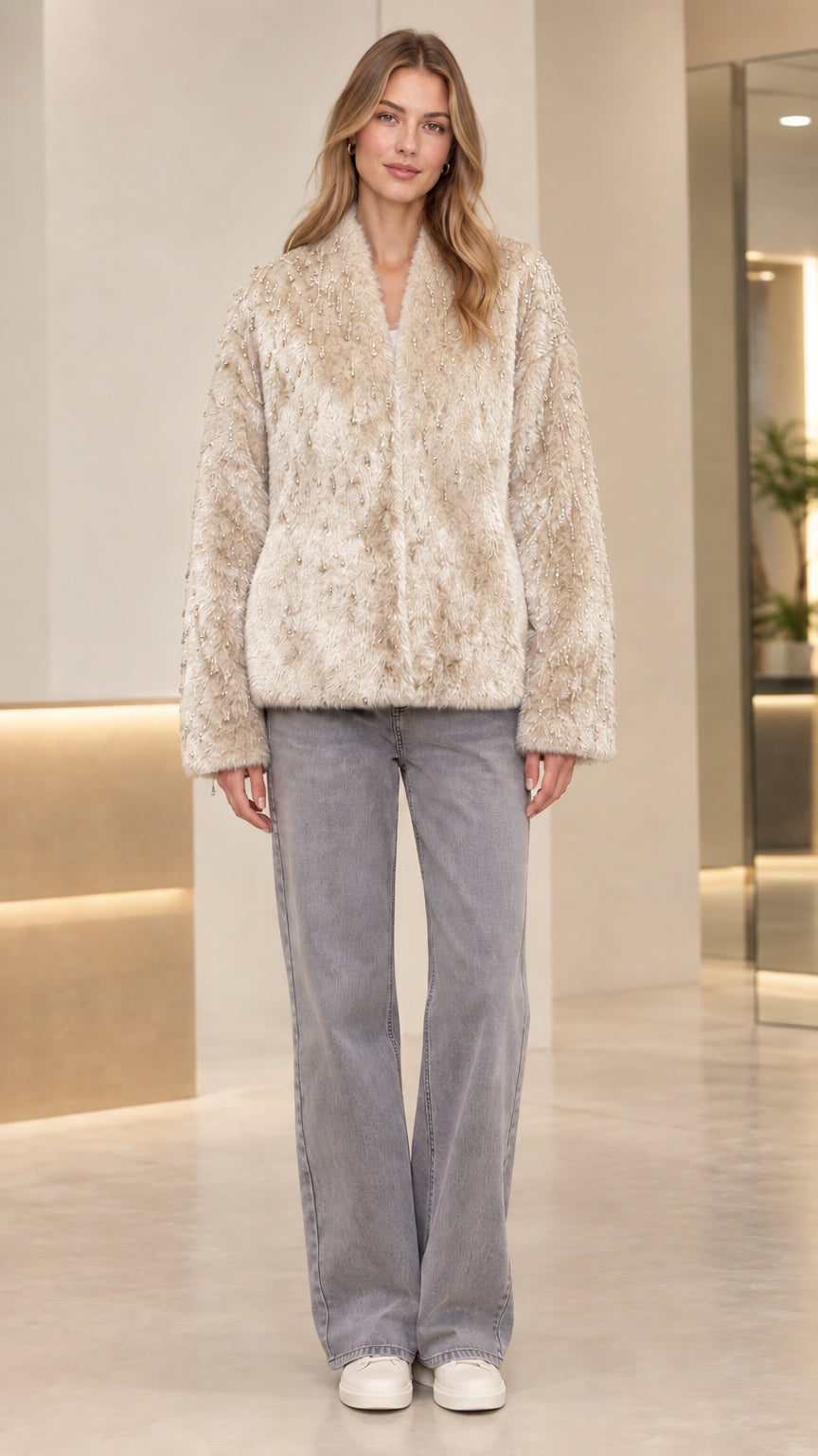 Front view of model wearing champagne beige beaded faux fur jacket