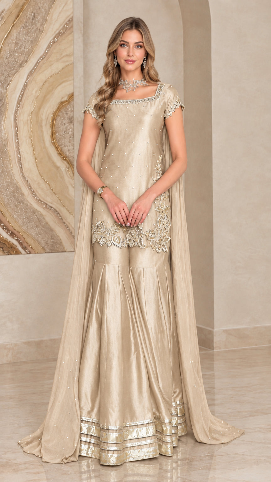 Champagne gold satin sharara suit set with sheer cape and gold embroidery