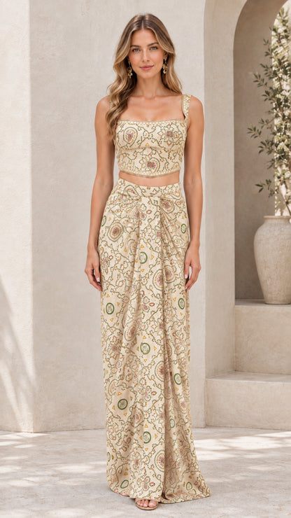 Model wearing champagne beige printed two-piece crop top and draped maxi skirt set