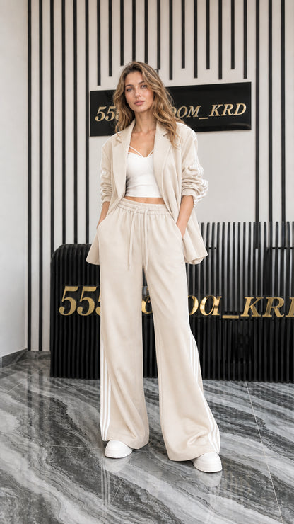 Full front view of women's beige 2-piece blazer and track pant set