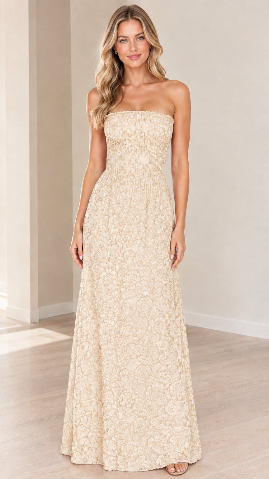 Front view of champagne cream strapless floral textured maxi dress