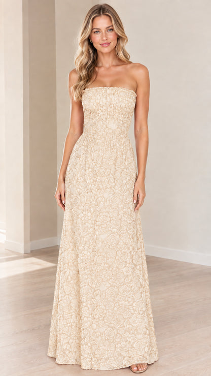 Front view of champagne cream strapless floral textured maxi dress