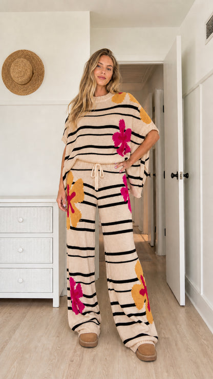 Model wearing beige floral striped knit two-piece casual lounge outfit