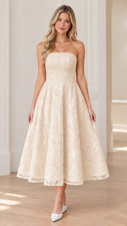 Front view of woman wearing strapless champagne floral lace midi dress