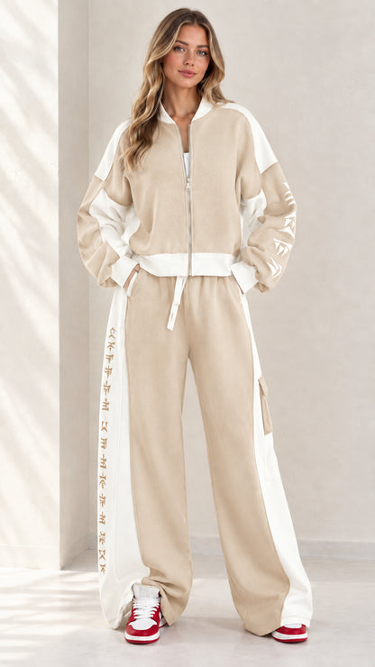 Full front view of model wearing beige khaki and white colorblock zip-up tracksuit set