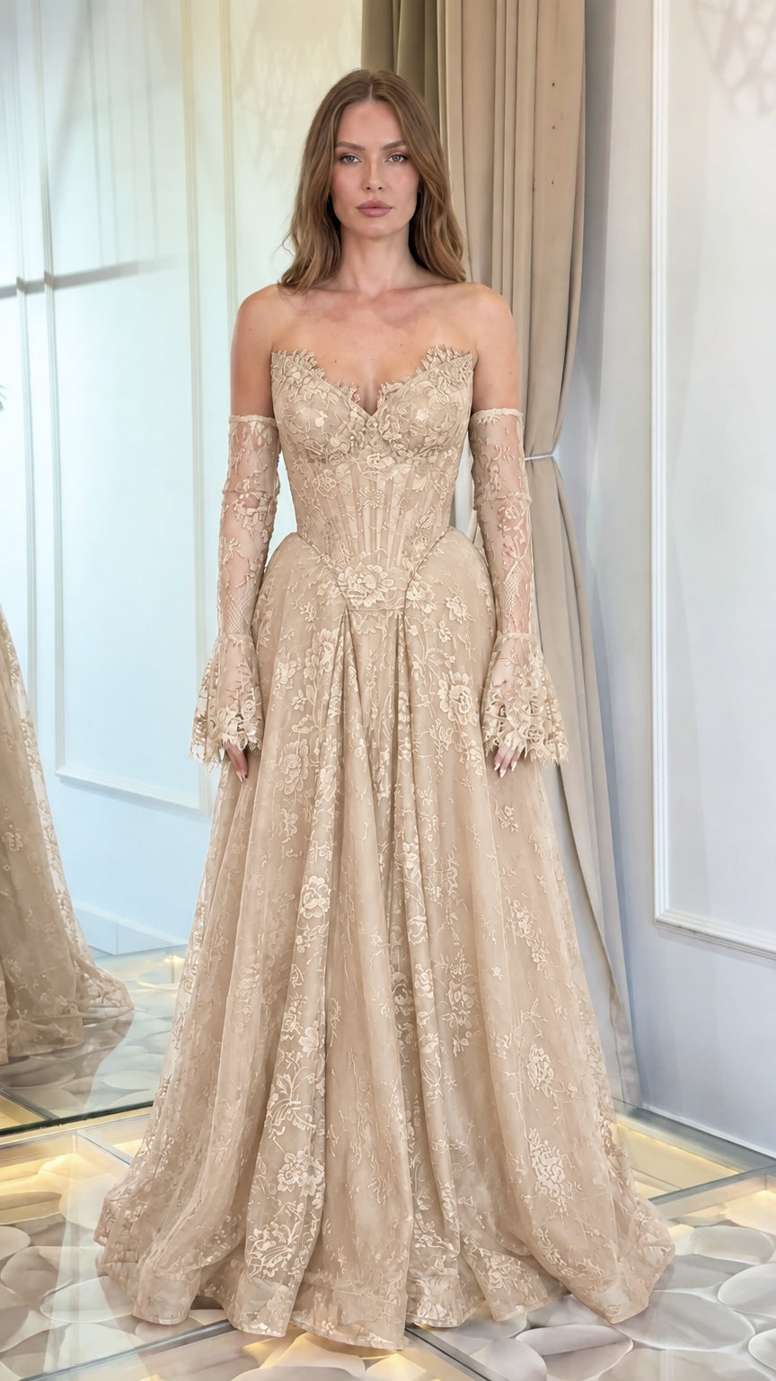 Front view of model wearing champagne gold lace corset evening gown with matching sleeves