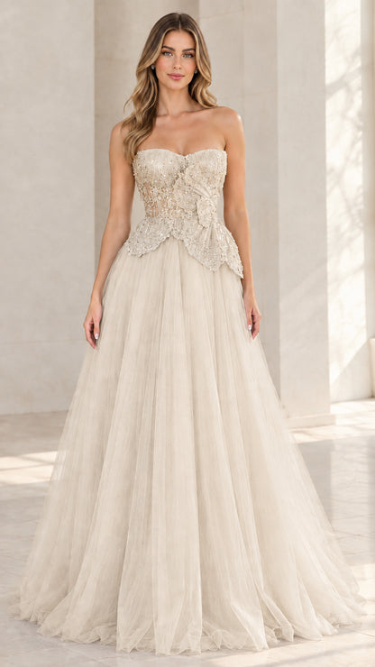 Model wearing champagne ivory strapless beaded tulle ball gown