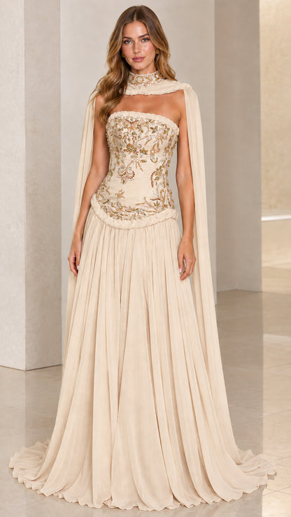 Champagne formal evening gown with gold beaded corset and draped sheer cape