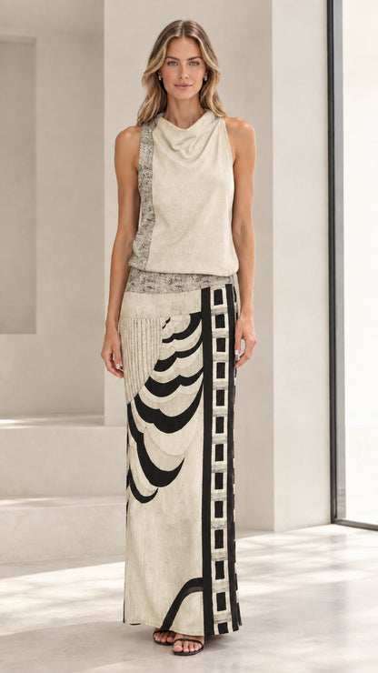Front full-length view of model wearing beige cream sleeveless cowl neck abstract maxi dress
