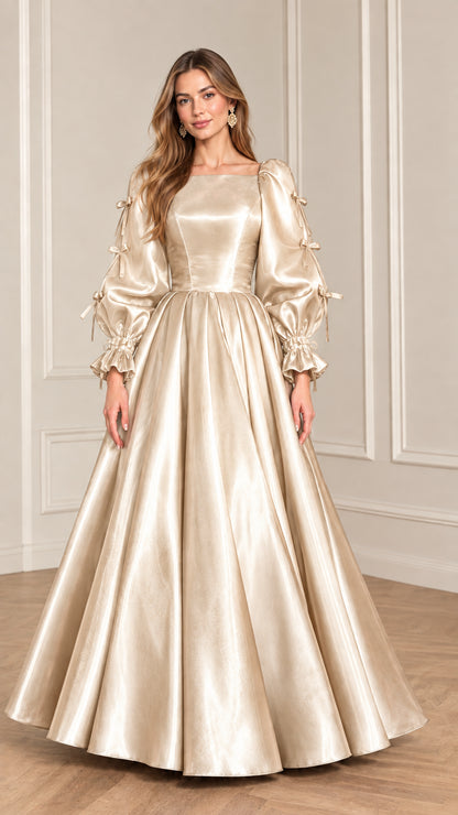 Full-length front view of model wearing Champagne gold satin puff sleeve ball gown