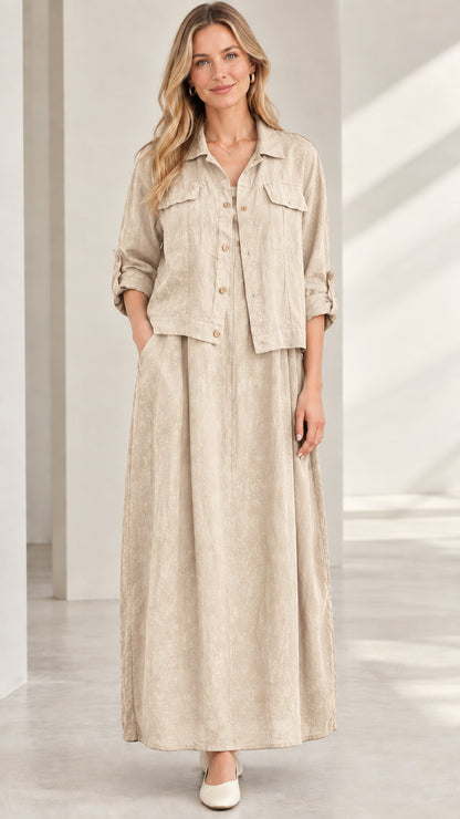 Model wearing beige natural sand colored two-piece shirt and maxi skirt set
