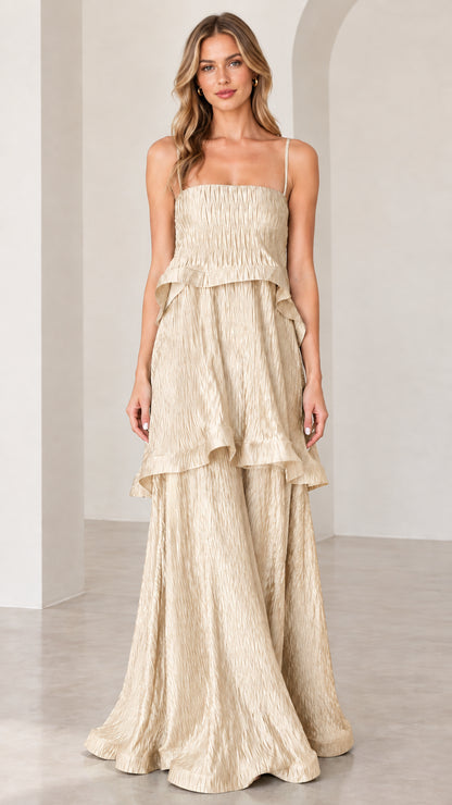 Model wearing champagne beige textured tiered sleeveless maxi dress