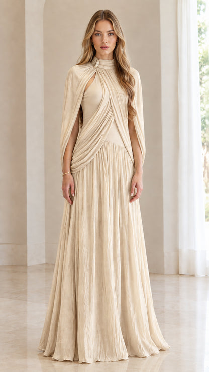 Front full-length view of woman wearing champagne cream pleated cape-sleeve formal gown