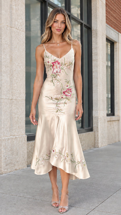 Model wearing champagne gold floral embroidered satin midi dress