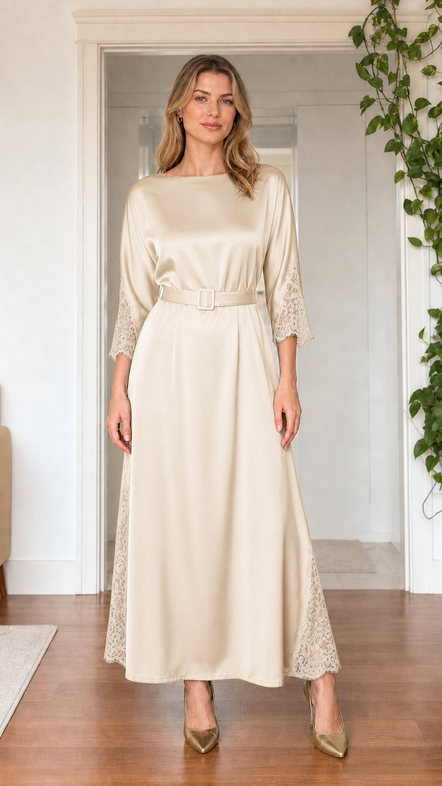 Front view of model wearing champagne cream satin maxi dress with belt
