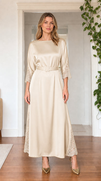 Front view of model wearing champagne cream satin maxi dress with belt