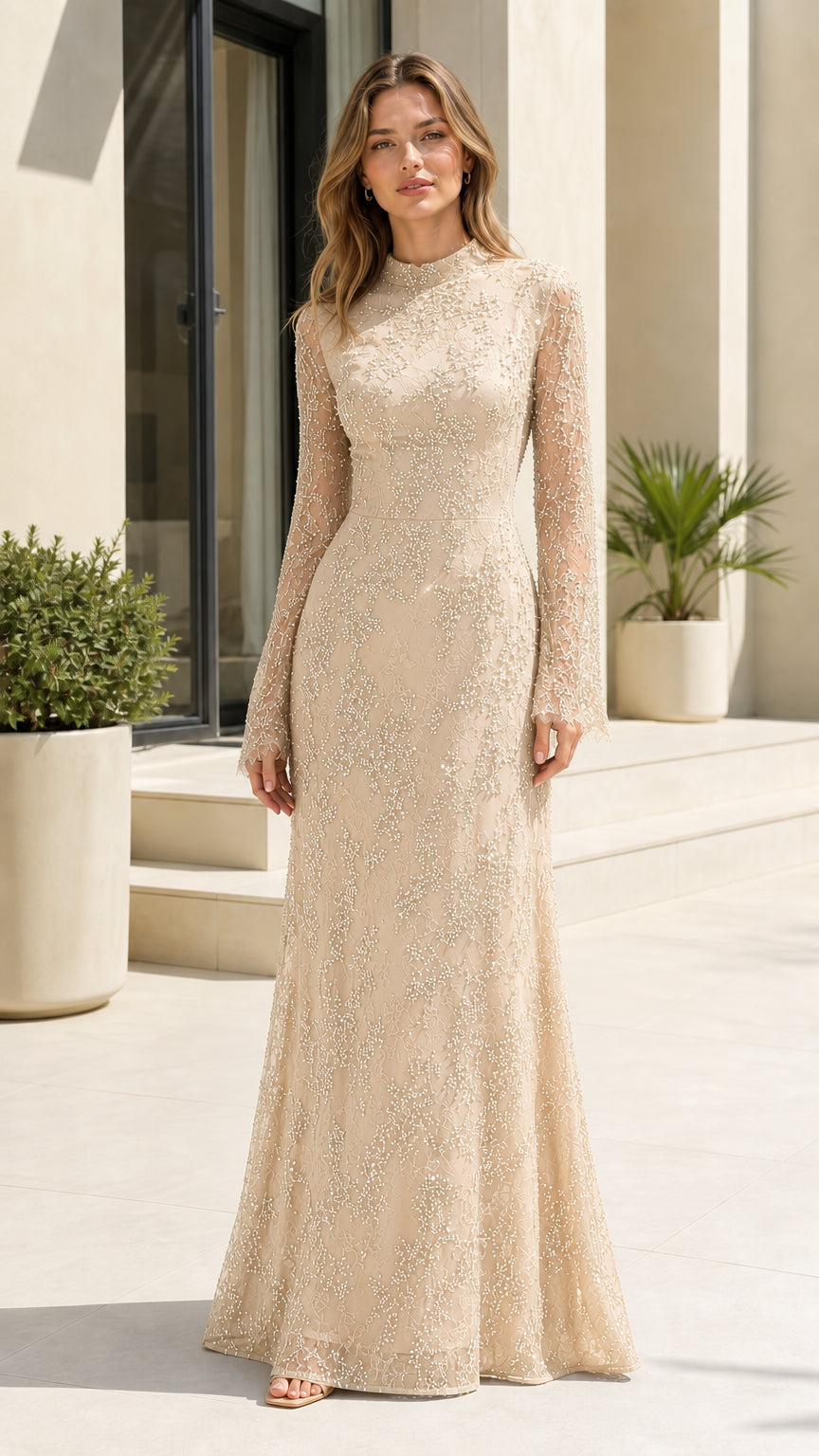 Full front view of champagne gold embellished lace long sleeve evening gown